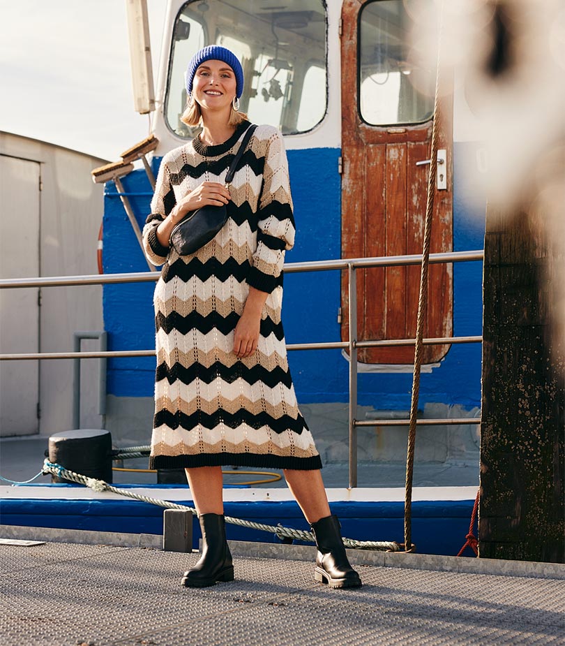 Model in striped knitted dress