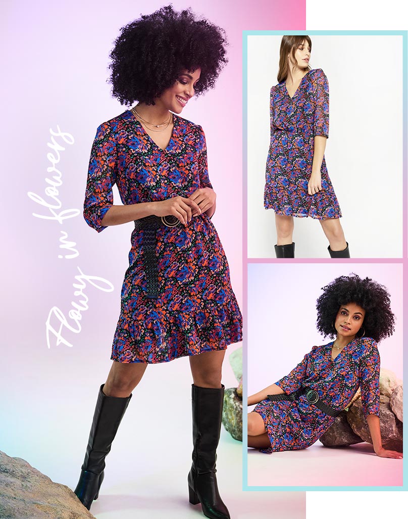 Floral mini dress with long sleeves and V-neck styled with black high knee boots and black belt.