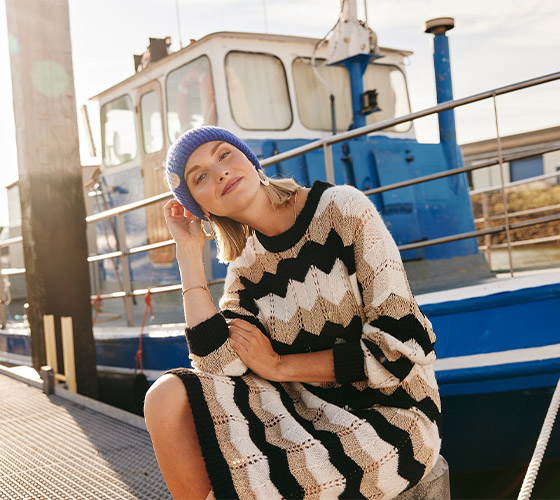 Model in striped knitted dress