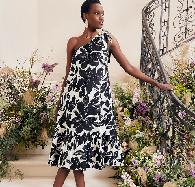 Model wearing a printed black & white dress